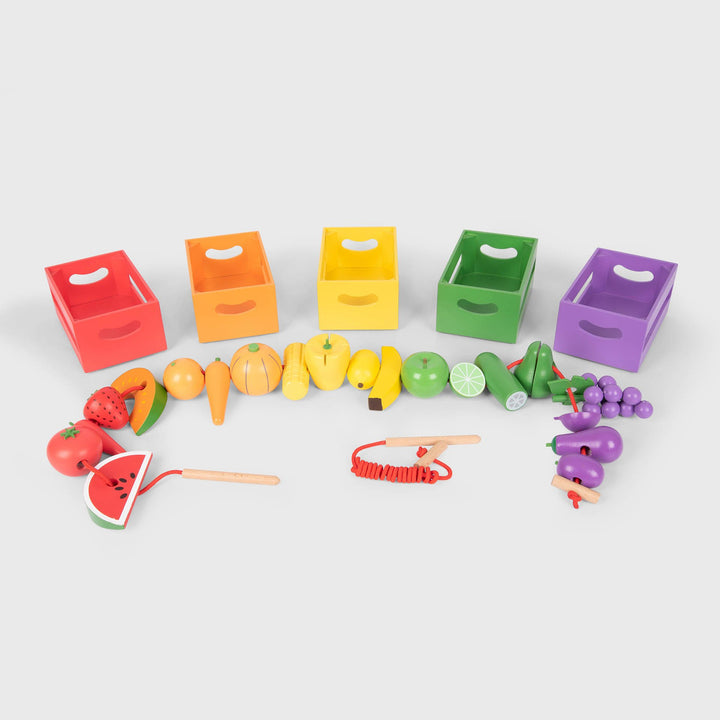 Fruit and Vegetable Colour Sorting Set, TickiT® Wooden Sorting Fruit & Vegetable Crates is a beautiful set of 5 stackable wooden crates filled with 20 individual hemu wood fruit and vegetable pieces. They are brightly coloured to match their colour coded crate with hand painted detail. Each crate contains two pieces of fruit and two vegetables, all with threading holes. There are two strings with wooden threaders and stops so your child can create delicious fruit and vegetable kebabs.The Fruit and Vegetable
