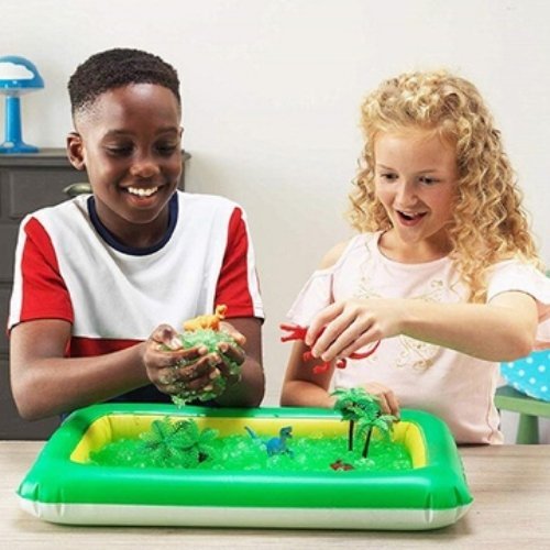 Gelli Worlds Dino Pack, Simply blow up the inflatable play tray and fill with water. Sprinkle a sachet of Gelli Play powder into the water to create a gooey, jelly experience! Use the Gelli Worlds Dino Pack to create your own Gelli adventure using the 8 dinosaur themed play pieces included. When play is finished, it’s safe to flush the Gelli away. Dinosaur Gelli World offers a fun, sensory tactile experience. Gelli World encourages creative, social and emotional development through messy play. It will be lo