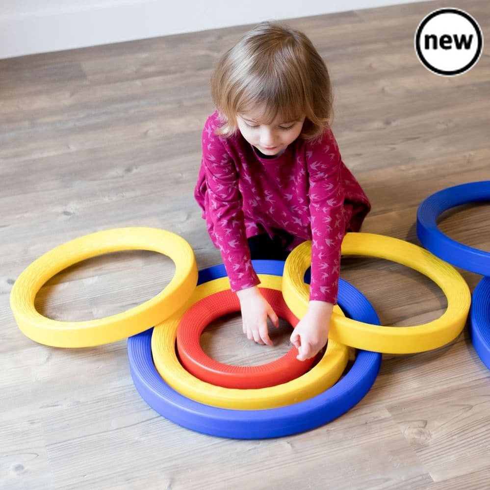 Giant Plastic Activity Rings Set, The Giant Plastic Activity Rings Set is a set of 9 high quality rings in 3 different sizes - 3 small (25cm diameter), 3 medium (35cm diameter) and 3 large (45cm diameter). The Giant Plastic Activity Rings Set come in different sizes which are colour coded for easy recognition. Use indoors or outdoors for a range of individual and group activities. Roll them, sort them by colour and size, sort materials inside them, throw bean bags into them or use them in imaginative play. 