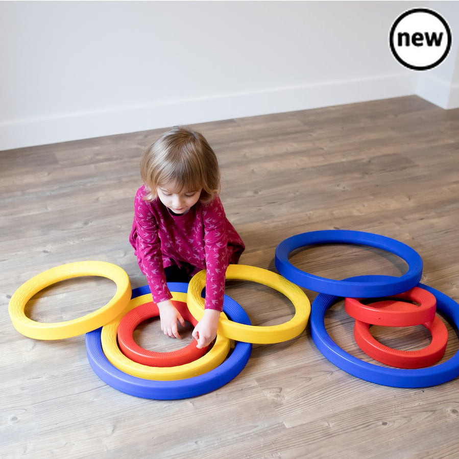 Giant Plastic Activity Rings Set, The Giant Plastic Activity Rings Set is a set of 9 high quality rings in 3 different sizes - 3 small (25cm diameter), 3 medium (35cm diameter) and 3 large (45cm diameter). The Giant Plastic Activity Rings Set come in different sizes which are colour coded for easy recognition. Use indoors or outdoors for a range of individual and group activities. Roll them, sort them by colour and size, sort materials inside them, throw bean bags into them or use them in imaginative play. 