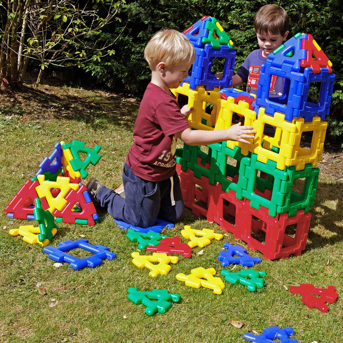 Giant Polydron Class Set, The Giant Polydron Class Set is the ultimate tool for building 2D and 3D shapes with triangles and squares, making it ideal for nurseries, early years, kindergartens, and reception classes. This class set is specifically designed for larger groups of children, providing an engaging and educational experience for everyone. With 80 pieces in total, including 40 squares and 40 triangles, this set offers ample resources for creative exploration and construction. The vibrant colors of t