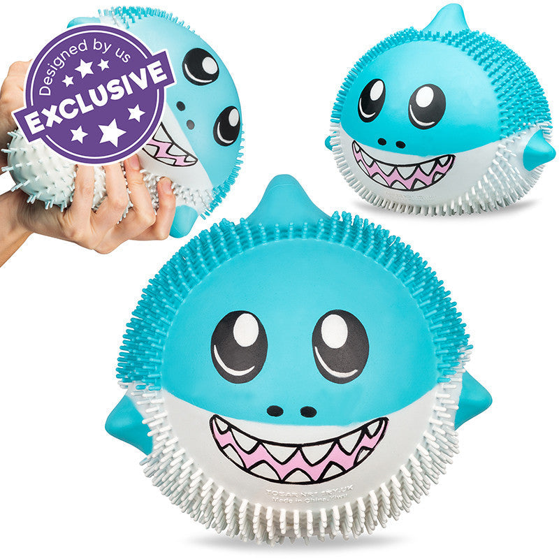 Giant Puffem Shark, Round puffy shark that can be squished and stretched in many ways, but always returns to its original shape. The features of our Giant Puffems are exaggerated to be extra cute, and they're covered in mini stretchy tendrils to make them extremely tactile in nature. Inside they are filled with a special foam which gives them a very unique and squishy property. It's a real challenge to put them down Large squishy shark Foam-like filling makes it extra squishy Stretchy features Always return