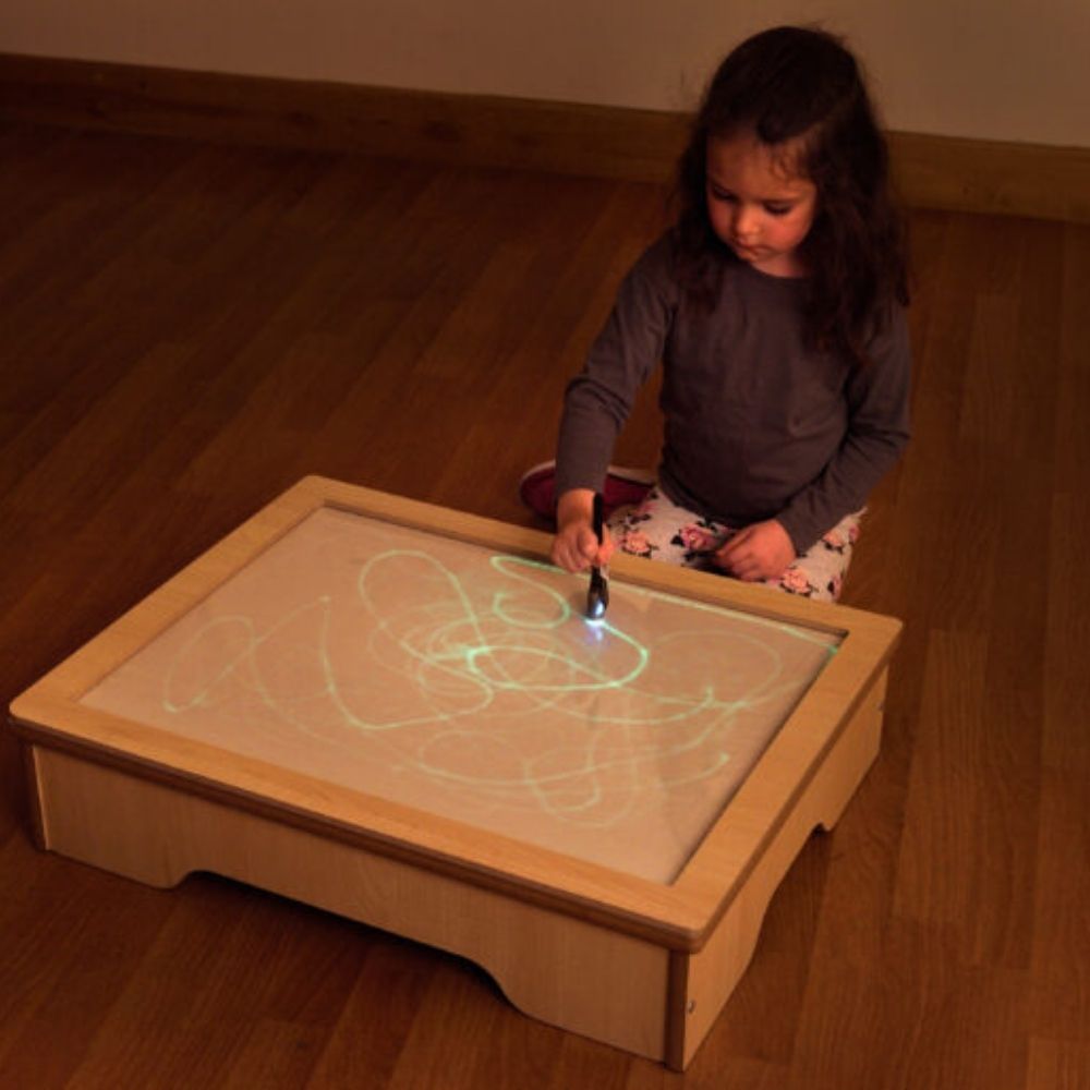 Glo Table, The Glo Table is a brilliant resource for early mark making and for encouraging creative skills in young children, and children with a range of special educational needs. The Glo Table is a great way to develop fine motor skills and gross motor skills using larger, whole arm movements to build up hand eye co-ordination and pencil control. The unique, sensory nature of this product makes it an ideal resource for children with special educational needs and is particularly suited to a wide range of 