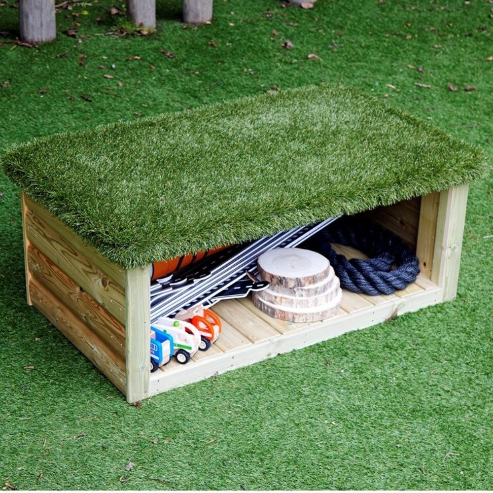 Grass Topped Bench with Storage, Complete your outdoor area with our Grass Topped Bench with Storage! This Grass Topped Bench with Storage has been designed to encourage group activities as children can sit, talk and play - enhancing their social and team-building skills. The artificial grass top can also be used as a base for small world animal play. The handy storage compartment underneath can be used to store a variety of items from messy play utensils to wellies. Made from FSC Scandinavian Redwood Deliv