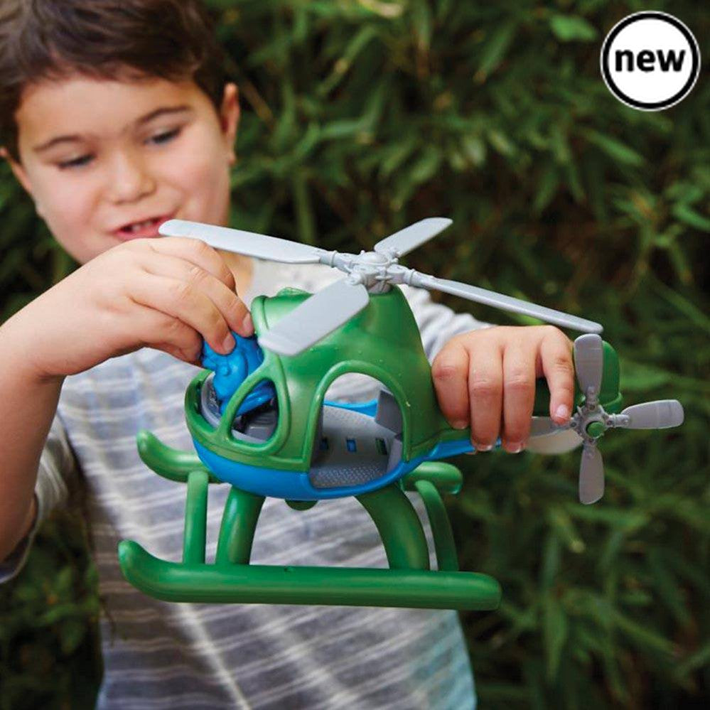 Green Toys Helicopter, Introducing the exhilarating Green Toys Helicopter - the ultimate adventure companion for children! This high-flying toy is designed to provide hours of entertainment and inspire imaginative play. With its two spinning rotors and sleek skids, this eco-friendly helicopter is ready to take flight! Your child can easily navigate the skies and land smoothly on the ground, thanks to the thoughtfully designed details. The spacious cockpit of the helicopter comes equipped with a full dashboa