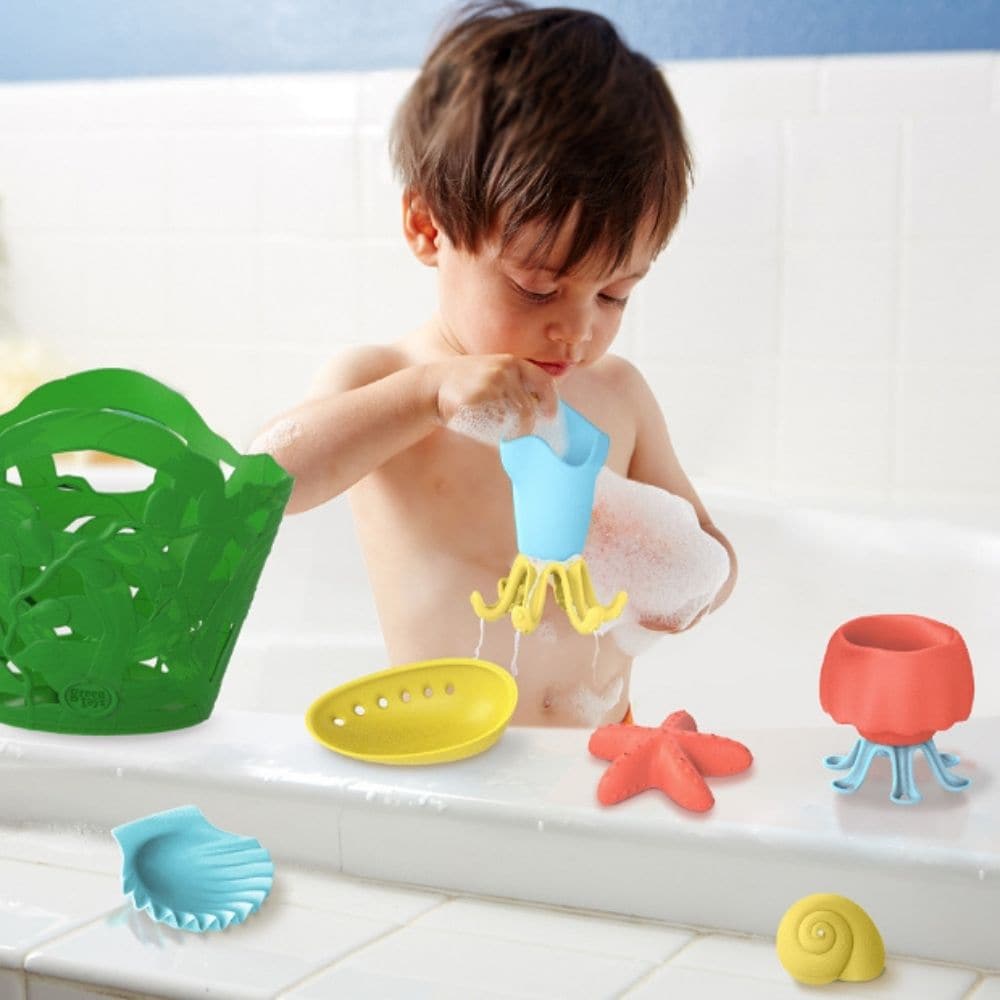 Green Toys Tide Pool Bath Set, Say goodbye to tears and tantrums at bath time with the Green Toys Tide Pool Bath Set. This 7-piece water toy set is made up of animals and shells that you may find in a rock pool including a starfish, scallop shell, moon snail shell, seaweed, jellyfish and squid! The seaweed bag makes for a great place to store the other bath toys once playtime is over. The handy holes drain away any excess water and allows for easy drying. The Green Toys Tide Pool Bath Set is made in the USA