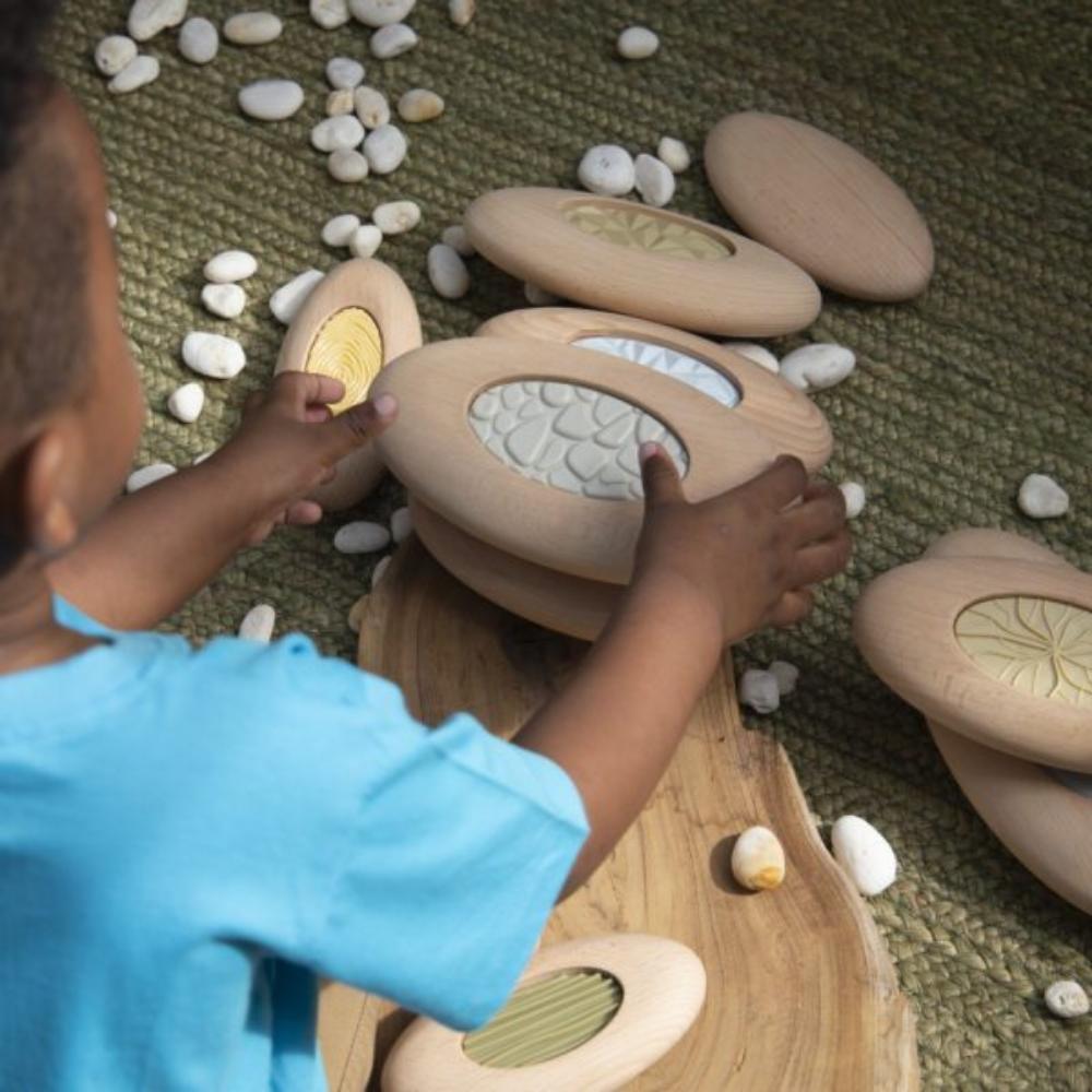 Guidecraft Jumbo Sensory River Stones, Smooth-sanded, over-sized beech wood Jumbo Sensory River Stones feature inset, nature-inspired textures. Children 2 and up can engage in sensory play while practicing stacking and balancing and strengthening their tactile differentiation. A beautiful, subdued color palette furthers the possibilities for organic connections during natural play.The Guidecraft Jumbo Sensory River Stones are over-sized, stone-shaped blocks made from beech wood feature plastic, inset textur