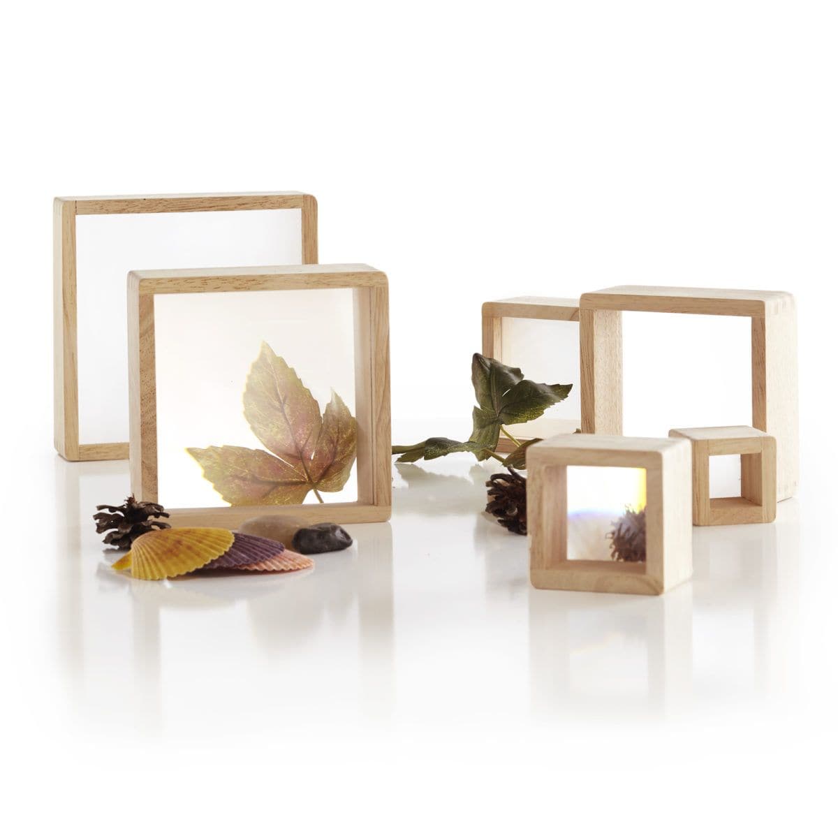Guidecraft Magnification Blocks, The Guidecraft Magnification Blocks come with Six stacking squares which feature hardwood frames, and smooth, rounded corners and edges, with inset magnified acrylic windows. The Guidecraft Magnification Blocks are Ideal for exploring natural, tactile, and other detailed materials found inside or in nature. Enhance STEM-based activities with the 6-piece set, perfect for group play. Largest square measures 7”W x 7”D x 2”H. Hardwood block set with inset lenticular windows Set 