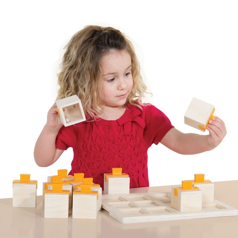 Guidecraft Peekaboo Sound Boxes, Let’s make some noise with the Peekaboo Sound Boxes! Shake the wooden cubes by their sturdy plastic handles to hear each unique rattling sound and find its match, and guess the material that makes each corresponding sound! Look through the translucent coloured acrylic on the base of each box for self-correction. The Guidecraft Peekaboo Sound Boxes builds matching, concentration and perception skills. Ages 3+ Wooden lock boxes to reinforce fine motor skills Set includes 12 pi