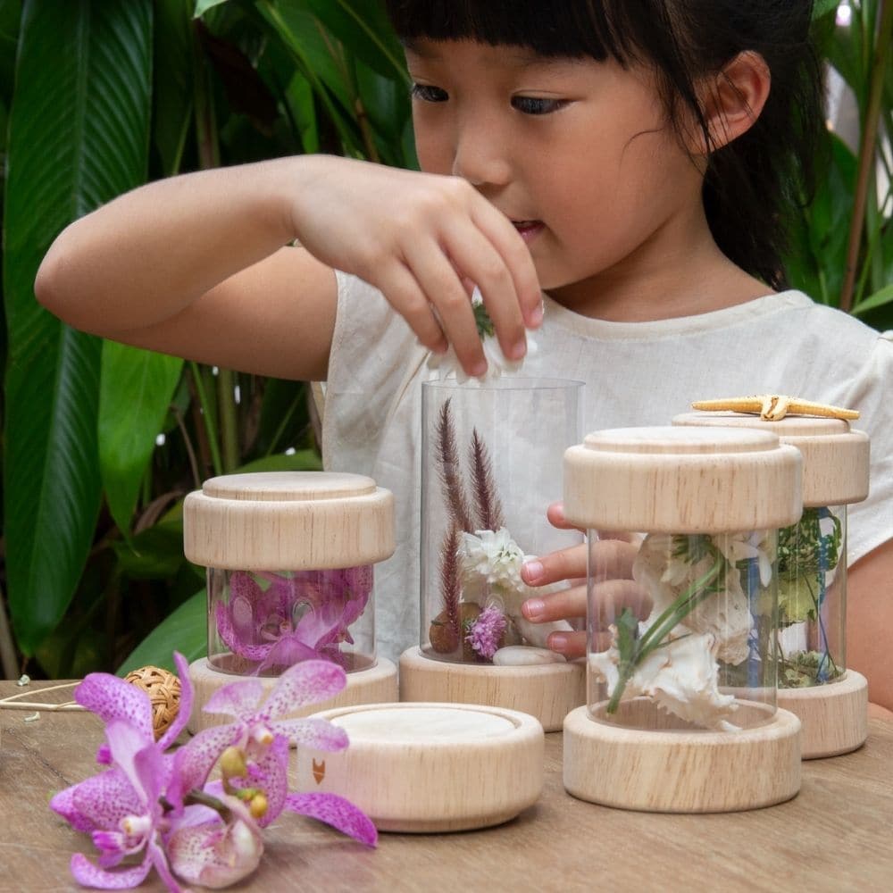 Guidecraft Treasure Tubes Clear, What makes a fun noise when you shake it? Find trinkets, natural materials and sensory objects to collect in the beautiful, stackable Treasure Tubes. The Guidecraft Treasure Tubes Clear are round, transparent acrylic tubes with removable covers hold small objects to observe, display or rattle. Ideal for color and sound exploration and light table activities. Holds marbles, beads, twigs, leaves, small toys and more. Stack the Guidecraft Treasure Tubes on top of each other to 