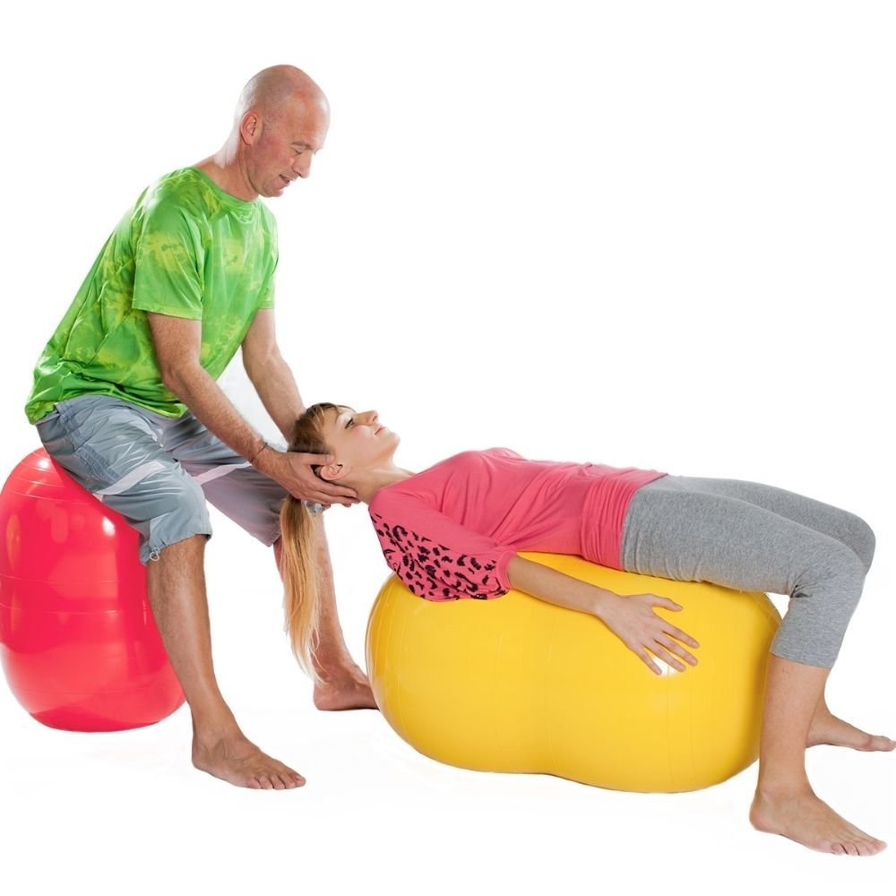Gymnic Physio Roll 55cm Ball, The Gymnic Physio Roll is ideal for therapeutic use, especially for those who have problems with balance and coordination. These Gymnic Physio Roll offer greater stability than regular, round therapy balls by limiting movement to forward and backward. The unique design of the Gymnic Physio Roll allows a therapist and a child to sit together on the Physio Roll. Children can also sit in the centre cradle for maximum comfort and support. The double ball design of Physio Roll makes