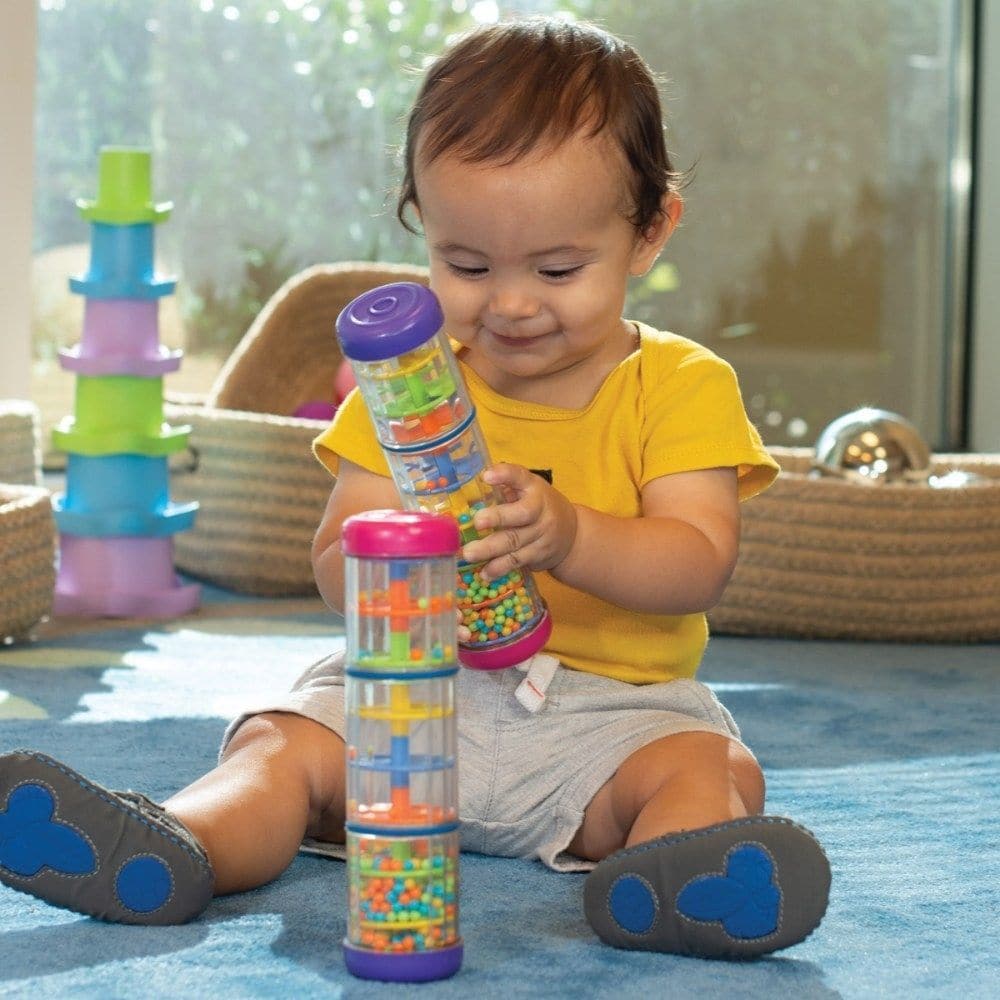 Halilit Mini Rainbomaker, Introduce your little ones to the soothing sound of the rain with the Halilit Mini Rainbomaker! This high-quality musical instrument is built to last and is perfect for young children who are just starting to explore the world of sound.With its colourful design and fascinating visual effects, the Halilit Mini Rainbomaker is sure to capture your child's attention for hours on end. As they turn the tube, they will watch in wonder as colourful beads cascade down through the twirling s