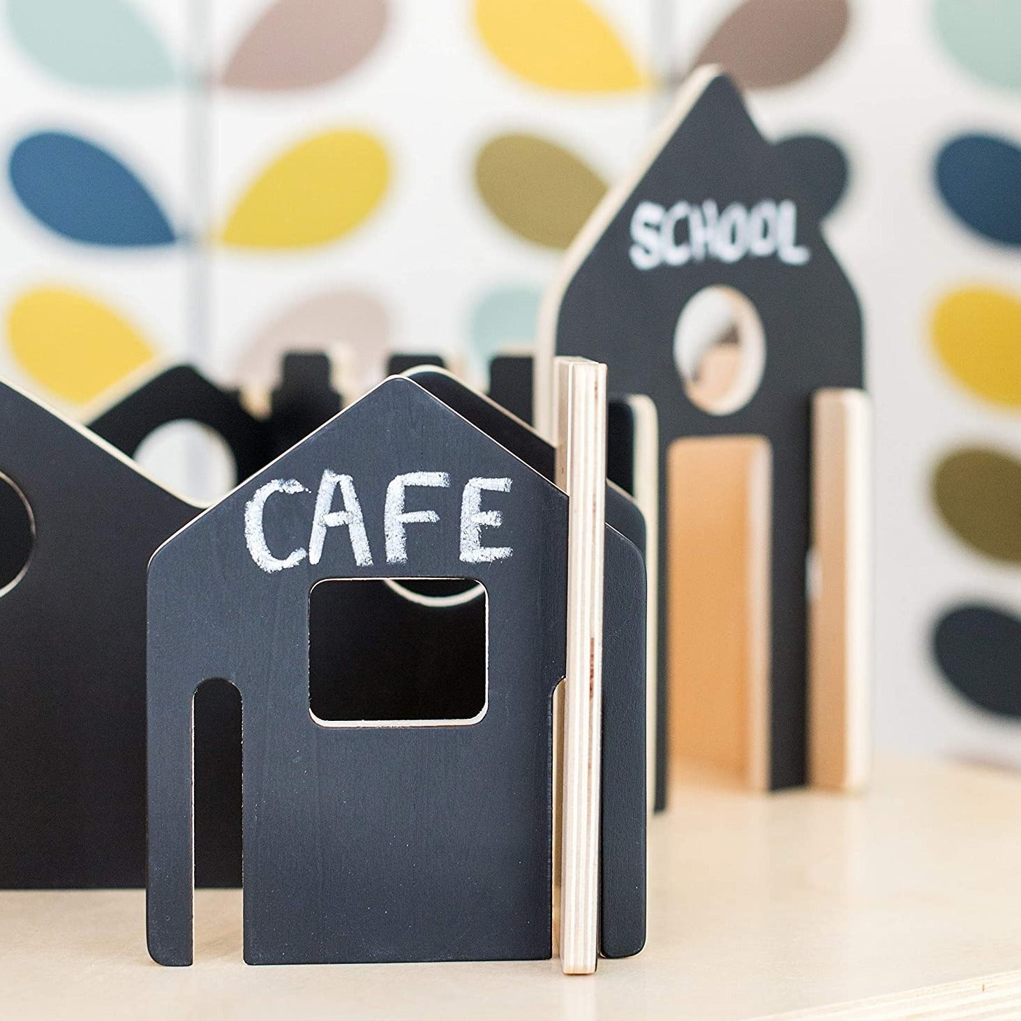 Happy Architect Chalkboard Create and Play Village - Pack of 28, The Happy Architect Chalkboard Create and Play Village is a creative, open-ended construction set. Build and create your own village with this chalkboard Happy Architect set. With a blackboard surface on one side to encourage children to use their imagination and explore a whole new world of their own, decorating one side as they choose, or practicing their words by naming buildings with words like library, school and home. The pieces slot eas