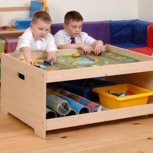 Hepworth Early Years Play Table, This generously sized Hepworth Early Years Play Table will comfortably allow four small children to play together. Hand holes at each end of the table allow it to be moved around quickly and easily. Includes shelf for storage, ideal for play mats and trays The Hepworth Early Years Play Table is perfect for small world play but also can be used for construction activities with train tracks and Lego etc. At the end of a session store mats away on the roomy shelf. There is plen