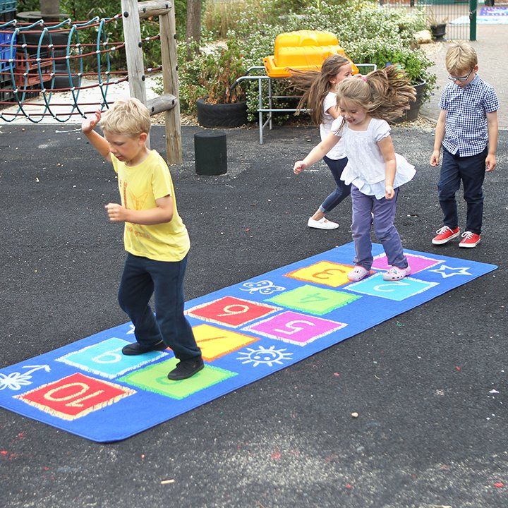Hopscotch Carpet Outdoor, The Hopscotch carpet is a brightly coloured 3m x 1m play mat. Great for use as a fun or learning activity, the hopscotch carpet also serves well as functional/decorative floor carpet. These large play and learn carpet mats are high quality and heavy duty tufted pile, soft texture rugs. The hopscotch play rug features a non-slip back. Carpets have a stain-resistant coating and are washable, featuring distinctive and brightly coloured, classroom relevant, designs. Brightly coloured 3