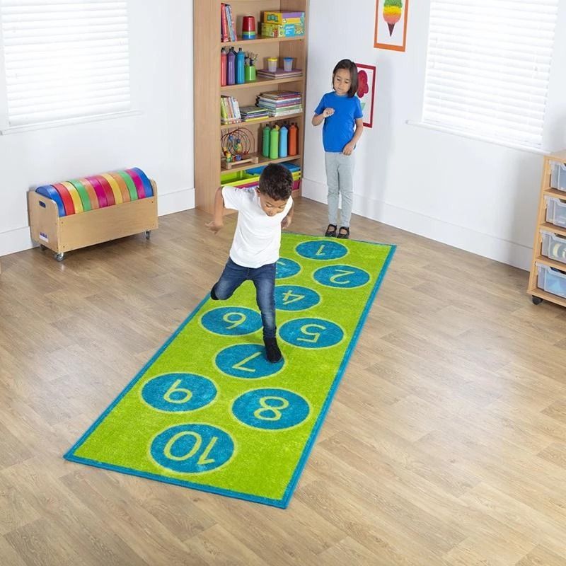 Hopscotch Carpet, Brightly coloured 3x1m carpet, for use as a fun learning activity and also serves well as functional/decorative floor carpet. Distinctive and brightly coloured, child friendly designs,designed to encourage learning through interaction and play. Brightly coloured 3x1m Hopscotch carpet, for use as a fun learning activity and also serves well as functional/decorative floor carpet. Hopscotch Carpet features: Distinctive and brightly coloured, child friendly designs. Designed to encourage learn