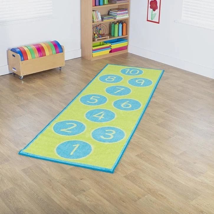 Hopscotch Carpet, Brightly coloured 3x1m carpet, for use as a fun learning activity and also serves well as functional/decorative floor carpet. Distinctive and brightly coloured, child friendly designs,designed to encourage learning through interaction and play. Brightly coloured 3x1m Hopscotch carpet, for use as a fun learning activity and also serves well as functional/decorative floor carpet. Hopscotch Carpet features: Distinctive and brightly coloured, child friendly designs. Designed to encourage learn