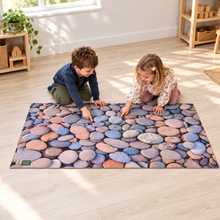 Images In Nature Pebbles Playmat 1.5m x 1m showing children exploring the printed scene with play props supplied separately