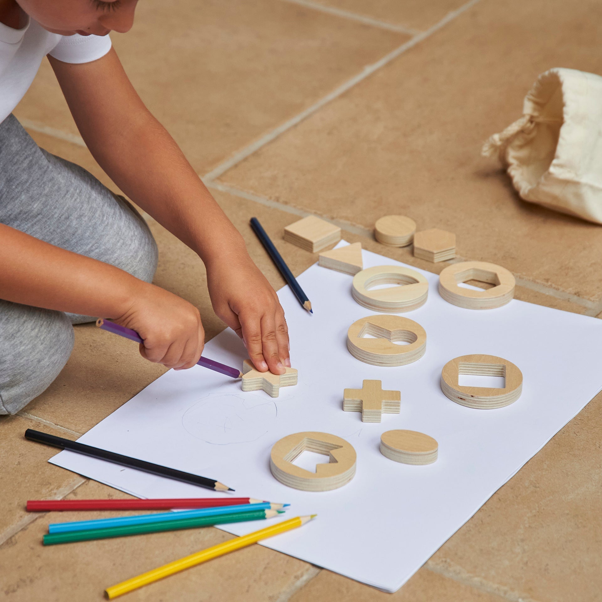 Inside Outside Wooden Shapes, Our TickiT® Inside Outside Wooden Shapes provide exciting and stimulating fun for your child to explore shape sorting and puzzle solving. A set of 14 smooth and tactile wooden discs, each with a different shape cut out and nested inside, which your child can take out for tracing, drawing around or pattern making. Each 1.2cm thick removable shape is chunky and easy for small hands to manipulate. With 7 geometric shapes (circle, oval, semicircle, triangle, square, rectangle and h