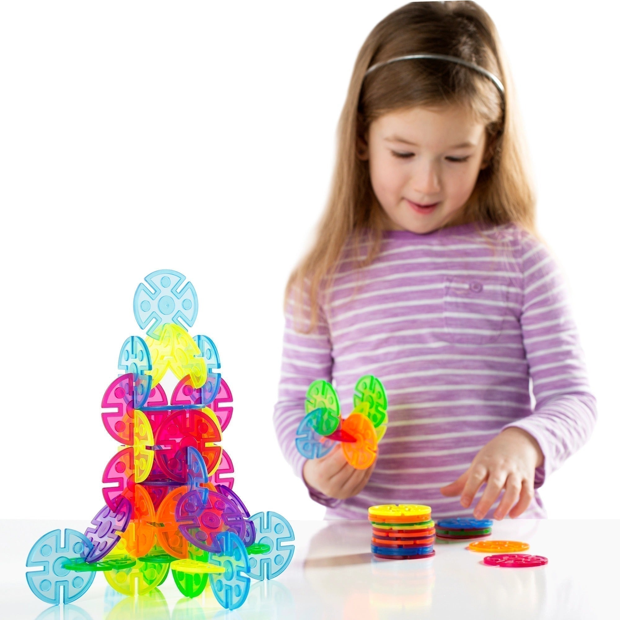 Interlox Discs 96 Piece Set, Interlox Discs provide colorful, easily interlocking building pieces to engage children in open-ended play. The Interlox Discs are made of colorful, translucent plastic with multiple notches for flexible building. Use the five beautiful colors to explore color theory on the LED Light Tablet or for other light and color activities. Children explore the concepts of symmetry and asymmetry while strengthening their design, structure and engineering skills. Use with the original Inte