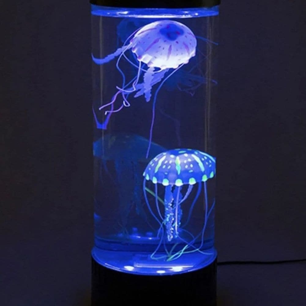Jelly Fish Lamp, The Jellyfish Lamp is perfect for those who would love to own an aquarium but simply do not have the time, the space, the finances or the desire to maintain a tank of living animals. The quirky Jelly Fish Lamp arrives with two imitation 'stingers' that will float around the tank in a natural manner, as soon as you fill have filled the tank with water. No mess, no fuss, just sit back and enjoy the view of the Jelly Fish Lamp. With its 3-piece LED lighting system in red, green and blue, the l