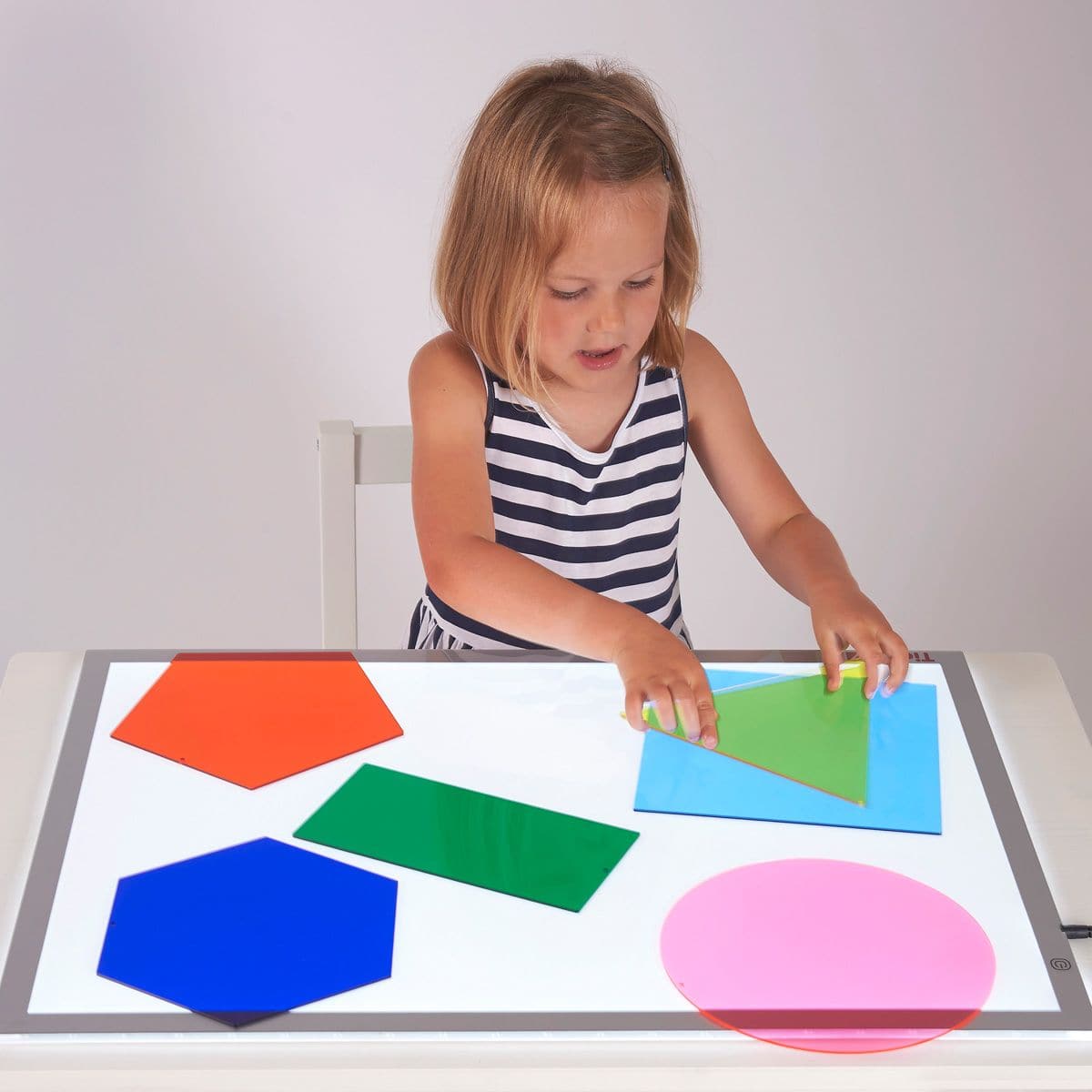 Jumbo Colour Mixing Shapes, The Jumbo Colour Mixing Shapes set contains 6 giant pieces of acrylic in different colours and with different shapes (red, blue, yellow, green, purple and orange – square, rectangle, circle, triangle, pentagon and hexagon). The Jumbo Colour Mixing Shapes are ideal for shape and colour recognition and for colour mixing, using as templates, and to support mathematical development. The Jumbo Colour Mixing Shapes are great for fascination play when used on a light box creating a stun