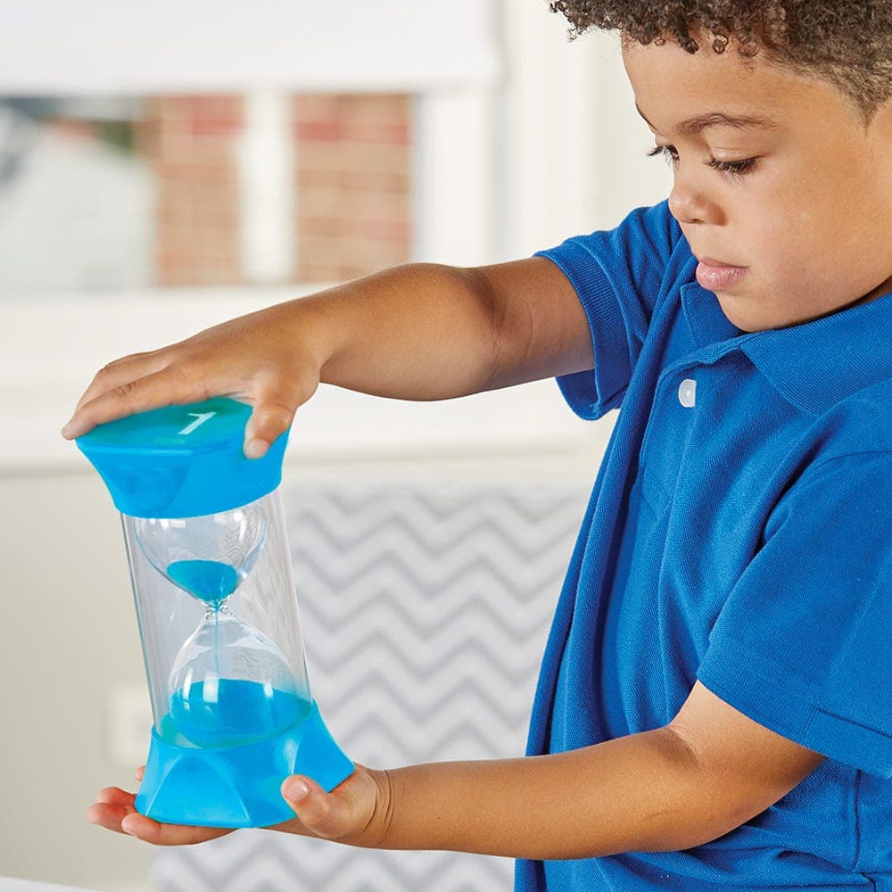 Jumbo Sand Timer (1-Minute), The Jumbo Sand Timer (1-Minute) is a versatile and educational tool that offers both teachers and parents an effective way to manage time and help children understand the concept of time passing. Its jumbo size, combined with the vibrant blue sand particles, makes it visually engaging for children. Jumbo Sand Timer (1-Minute) Features: Visual Aid: The large sand particles in a vivid blue colour provide a compelling, visual representation of approximately one minute passing, help