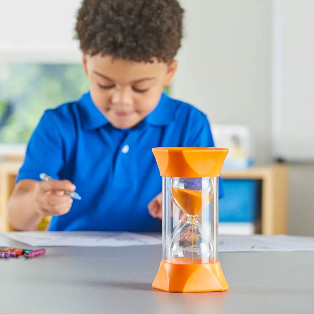 Jumbo Sand Timer (5-Minute), The Jumbo Sand Timer (5-Minute) serves as an excellent educational tool for both classroom and home environments, offering children a vivid, visual way to understand the concept of a five-minute interval. With its large design and orange sand, it can captivate young learners while teaching them valuable lessons about time. Key Features: Visual Representation: The sand timer's orange sand and jumbo size provide a fascinating, visual means for children to see the passing of approx