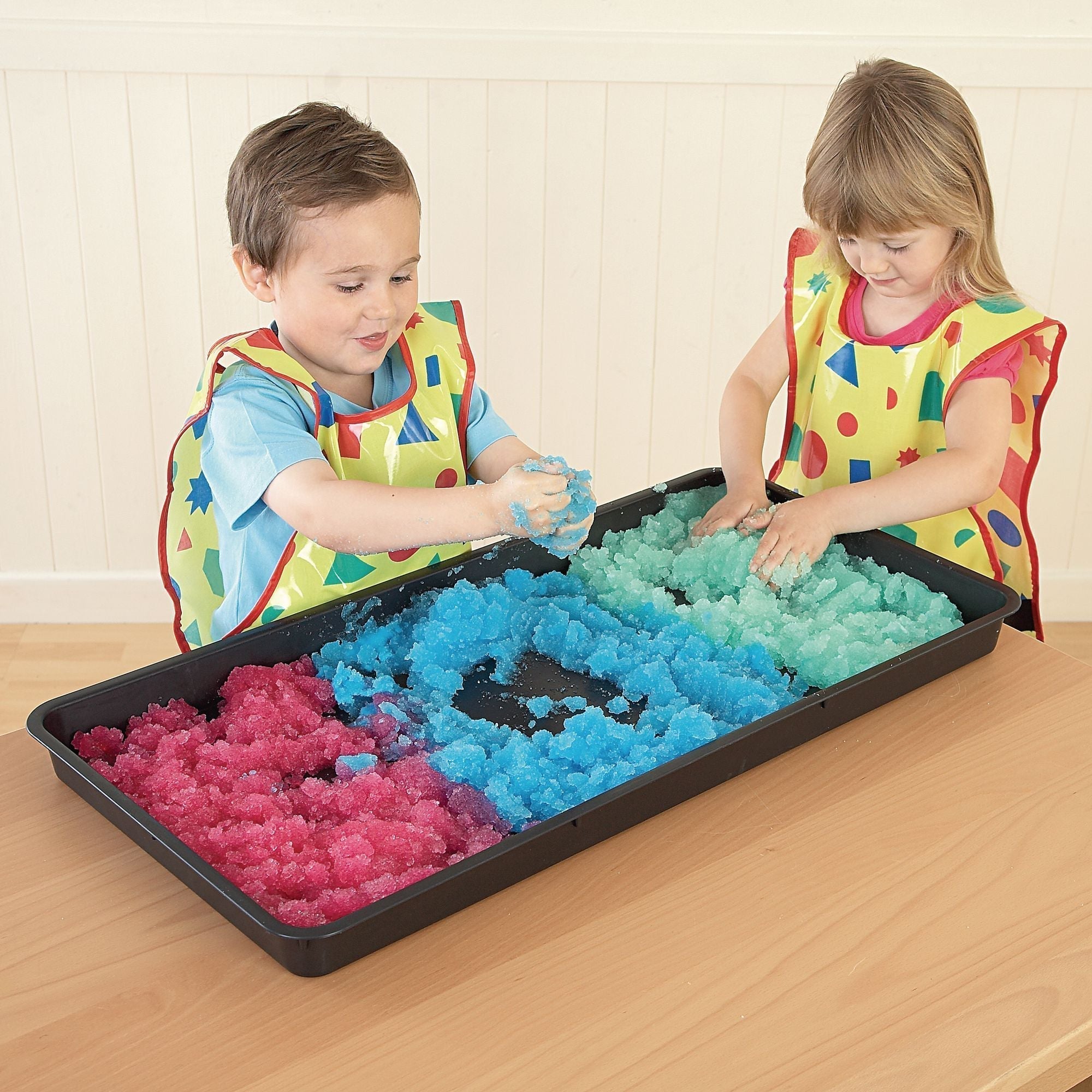 Jumbo Tray Rectangle, Meet your newest educational and recreational ally: the Versatile Sensory Tray. Crafted from durable rectangular plastic, this multi-purpose tray is the ideal companion for all types of messy play, be it indoors or outdoors. Its optimally-sized design makes it a perfect fit for table tops and low storage spaces, ensuring it's always close at hand for spontaneous fun. From channeling water to creating a makeshift sandpit or even an outdoor painting station, the potential activities are 