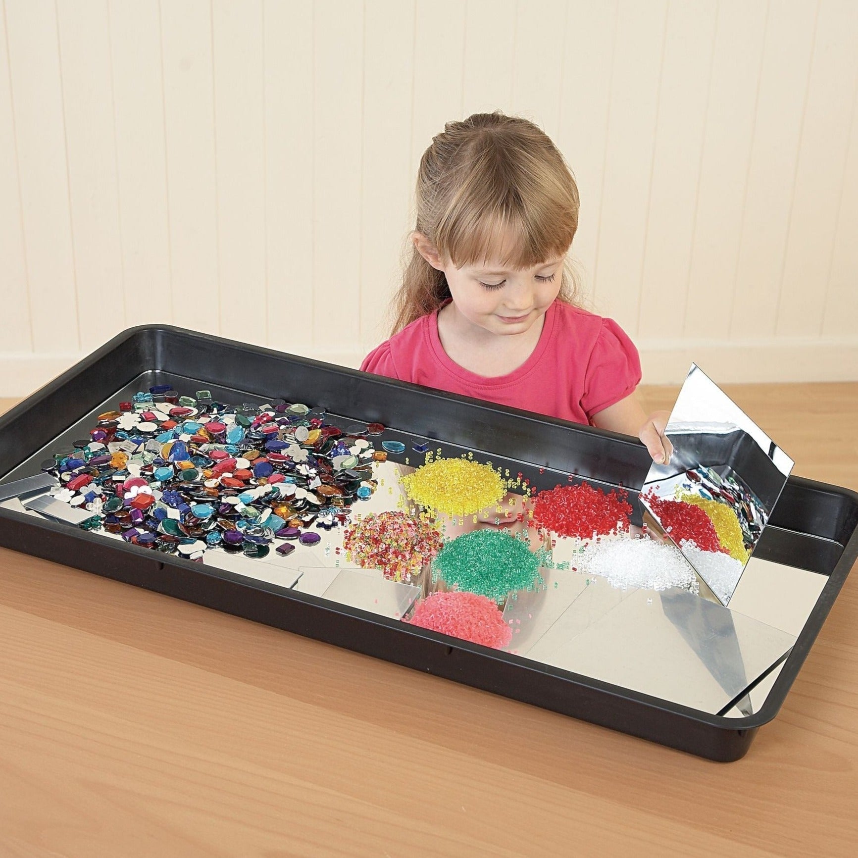 Jumbo Tray Rectangle, Meet your newest educational and recreational ally: the Versatile Sensory Tray. Crafted from durable rectangular plastic, this multi-purpose tray is the ideal companion for all types of messy play, be it indoors or outdoors. Its optimally-sized design makes it a perfect fit for table tops and low storage spaces, ensuring it's always close at hand for spontaneous fun. From channeling water to creating a makeshift sandpit or even an outdoor painting station, the potential activities are 