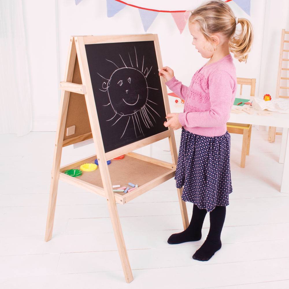 Junior Art Easel, Creative skills can easily be nurtured with this versatile wooden Junior Art Easel.The Junior Art Easel features a dry wipe magnetic whiteboard on one side, with a traditional blackboard on the other.The Junior Art Easel also includes a paper roll which can easily be affixed to the easel, four paint pots, a board eraser and 12 sticks of coloured chalk. Made from high quality, responsibly sourced materials. Conforms to current European safety standards. Creative skills can be nurtured with 
