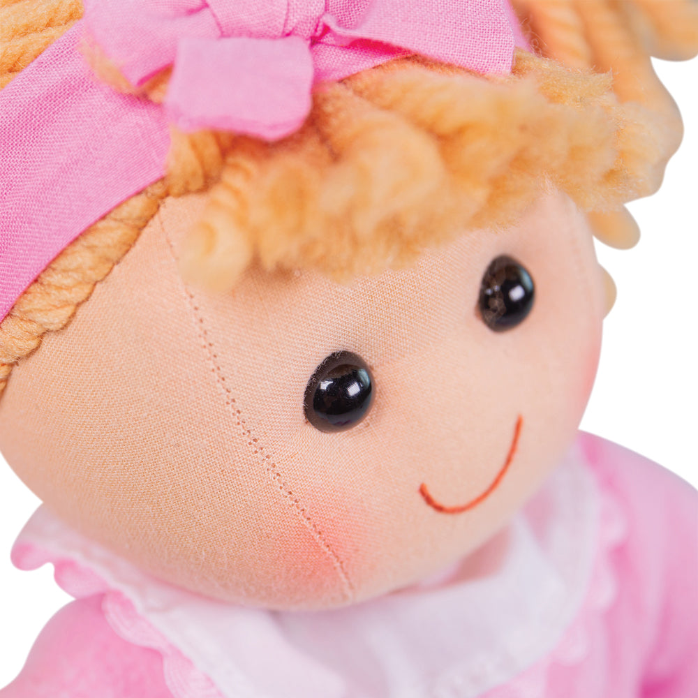 Kelly Doll - Medium, Introducing Kelly, the adorable and huggable doll that is ready to be your little one's newest best friend! With her charming pink dress and a matching cardigan, Kelly is the epitome of cuteness and style.Designed with attention to detail, this soft and cuddly doll will engage your child's imagination during playtime. Kelly's gentle expression and lovable features make her incredibly endearing, capturing the hearts of both kids and adults alike.Whether your little one wants to have a te