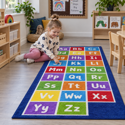 Child learning letters beside the Kinder Alphabet Runner Carpet