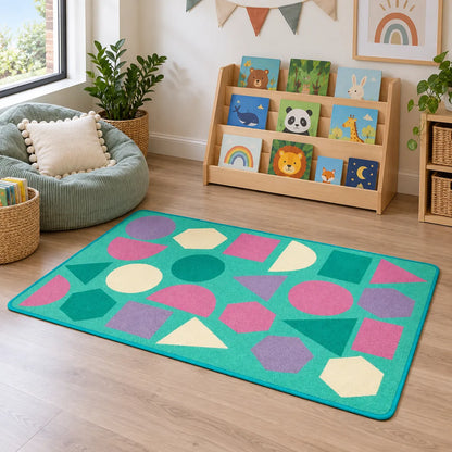 Kinder Pastel Geometric Nursery Rug in reading area without children