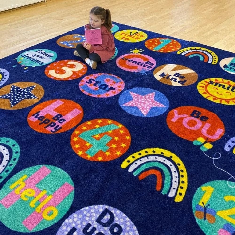 KinderColour Positivity Wellbeing Placement Carpet 3 x 3 metre, Introducing our KinderColour Positivity Wellbeing Placement Carpet, a versatile and durable addition to any classroom or learning environment. This carpet provides clearly identifiable seating areas for up to 30 children, promoting organization and structure within the space.Designed with vibrant and eye-catching colors, our carpet features positive sayings and messages that enhance and reinforce wellbeing throughout the classroom. These uplift
