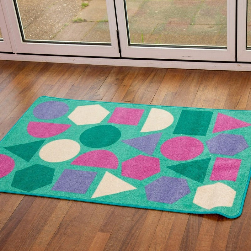 Kinder™ Pastel Geometric Nursery Rug, Introducing our Kinder™ Pastel Geometric Nursery Rug , designed to aid young children in developing their understanding of shapes and spaces. This Kinder™ Pastel Geometric Nursery Rug is the perfect addition to any early years or primary school learning environment.Constructed with our Heavy Duty Dura-Pile™, this rug features a premium quality carpet with an extra thick pile, ensuring both comfort and longevity. The soft textured tufted Nylon twist pile provides a plush