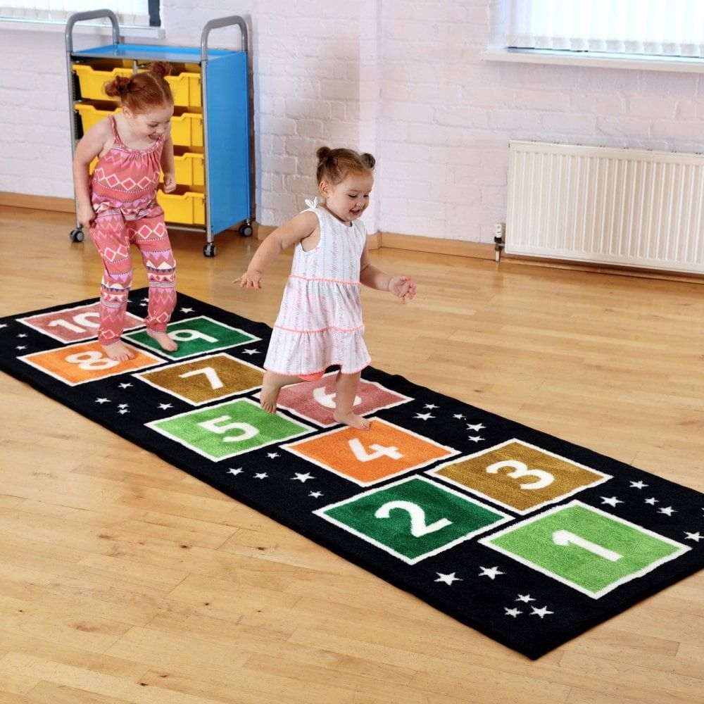 Kinder™Number Hopsotch Runner Carpet 3 X 1 Metre, Introducing the Kinder Number Hopsotch Runner Carpet, the perfect interactive tool for children to learn and have fun! Measuring 3 x 1 metre, this carpet features the numbers 1 to 10, providing a playful way for kids to practice their counting skills.Crafted from heavy-duty dura-Pile™, this premium quality carpet is built to withstand the test of time. With its extra thick pile, it not only provides a comfortable surface for little ones to hop and play on bu