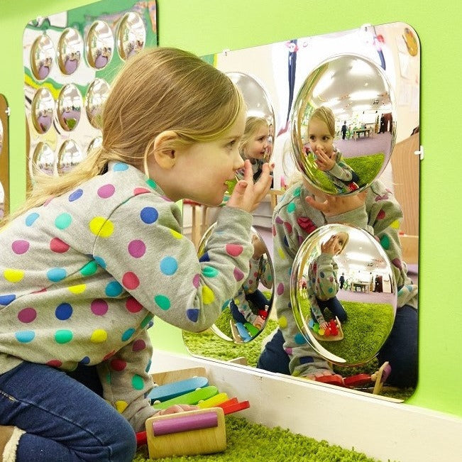 Large 4-Domed Acrylic Mirror Panel, The Large 4-Domed Acrylic Mirror Panel is made from scratch resistant acrylic these 4 Domed Mirror panels are safe and ideal for any classroom or nursery setting. Children are drawn to the Large 4 Domed Acrylic Mirror panels for the observation of themselves and objects. The convex mirror domes provide a distorted, fun and interesting view of the world for children to explore. The Large 4 Domed Acrylic Mirror can be sited inside or outside and come with sticky pads and co