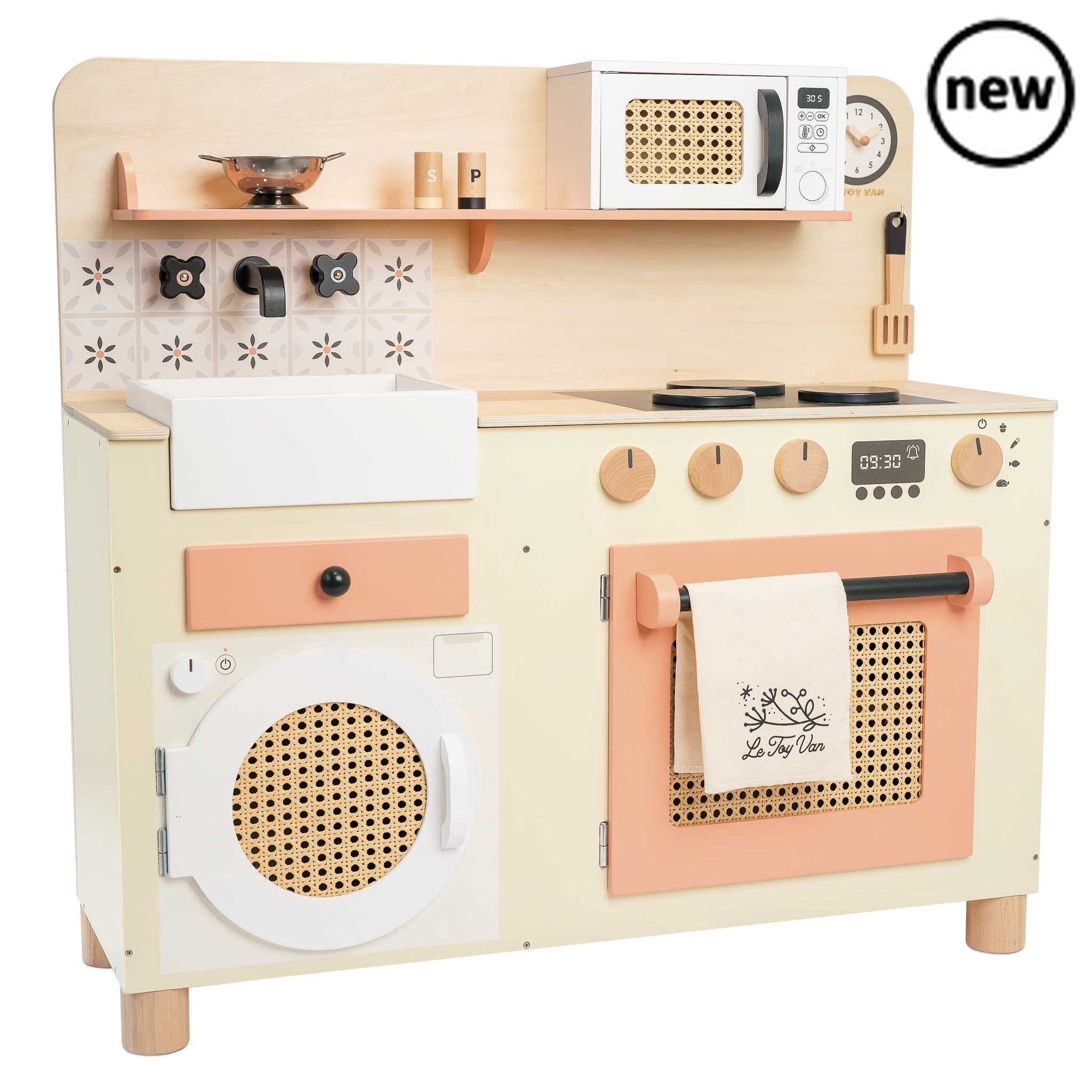Large Kitchen, Description Cook up some heavenly dishes with this retro style mini wooden kitchen of dreams. Budding bakers will delight with this showstopper that’s packed with interactive features for hours of realistic play value. In a soft pastel and natural wood design, with pretty printed tiles and rattan detailing, this high quality, sustainable toy is made from solid FSC® - certified wood. Discover the butlers sink, oven, washing machine, rotating taps and working oven dials. Plus, there’s a microwa