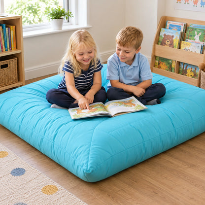 Aqua Large Quilted Cushion — children sharing a book
