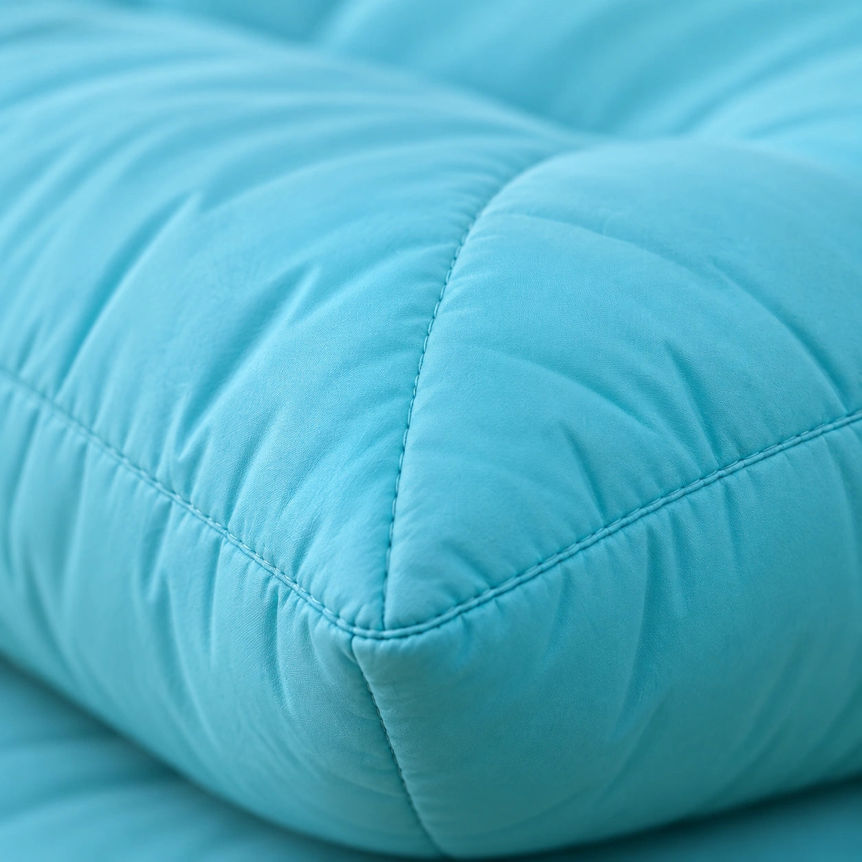 Aqua Large Quilted Cushion — quilted material and seam detail