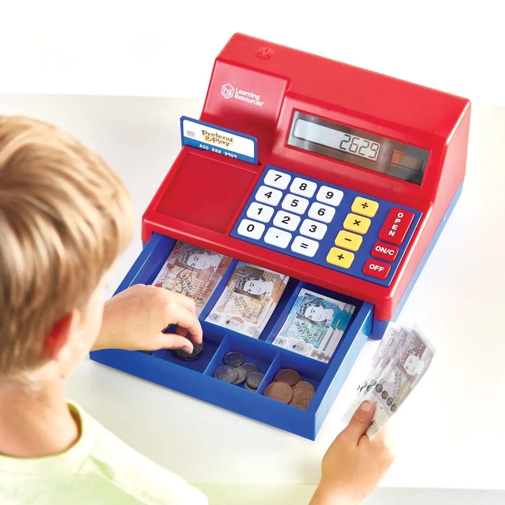 Learning Resources Pretend & Play Cash Register, Bring the world of commerce right into your home or classroom with the award-winning Learning Resources Pretend & Play Cash Register. This robust and interactive toy cash register not only fuels imaginative play but also serves as an excellent tool for introducing early maths skills. Designed with children in mind, the Pretend & Play Cash Register features oversized buttons and a large digital display, making it simple and fun for little hands to operate. The