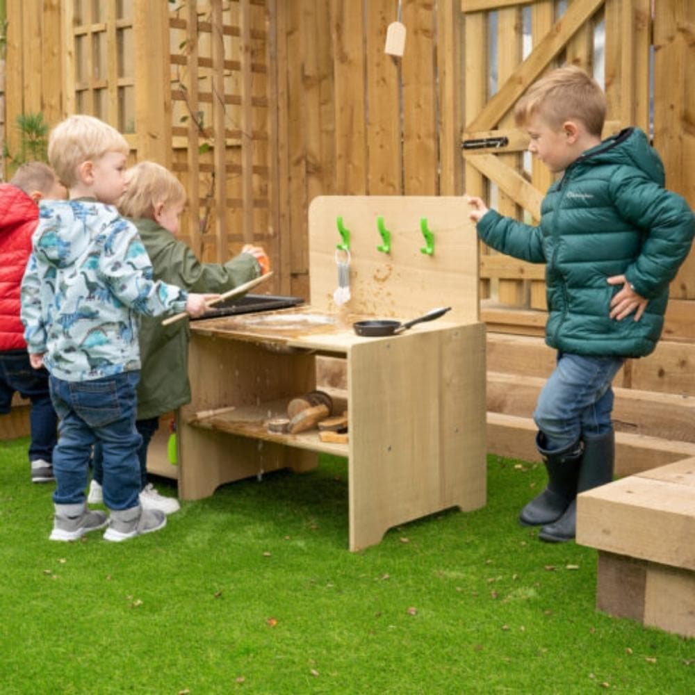 Leave Me Outdoor Mini Mess Around Kitchen, From our Leave Me Outdoors Range this Outdoor Mess Around Kitchen is a fantastic role play product that can safely be left outdoors all year round. An outdoor low-level kitchen designed for under 2s, complete with a stainless-steel bowl and ‘toughooks’ to hang utensils. The Outdoor Low Level Kitchen is a practical, open-ended addition to any outdoor setting, which also includes a handy shelf underneath to store resources. Can be used side by side with our low-level