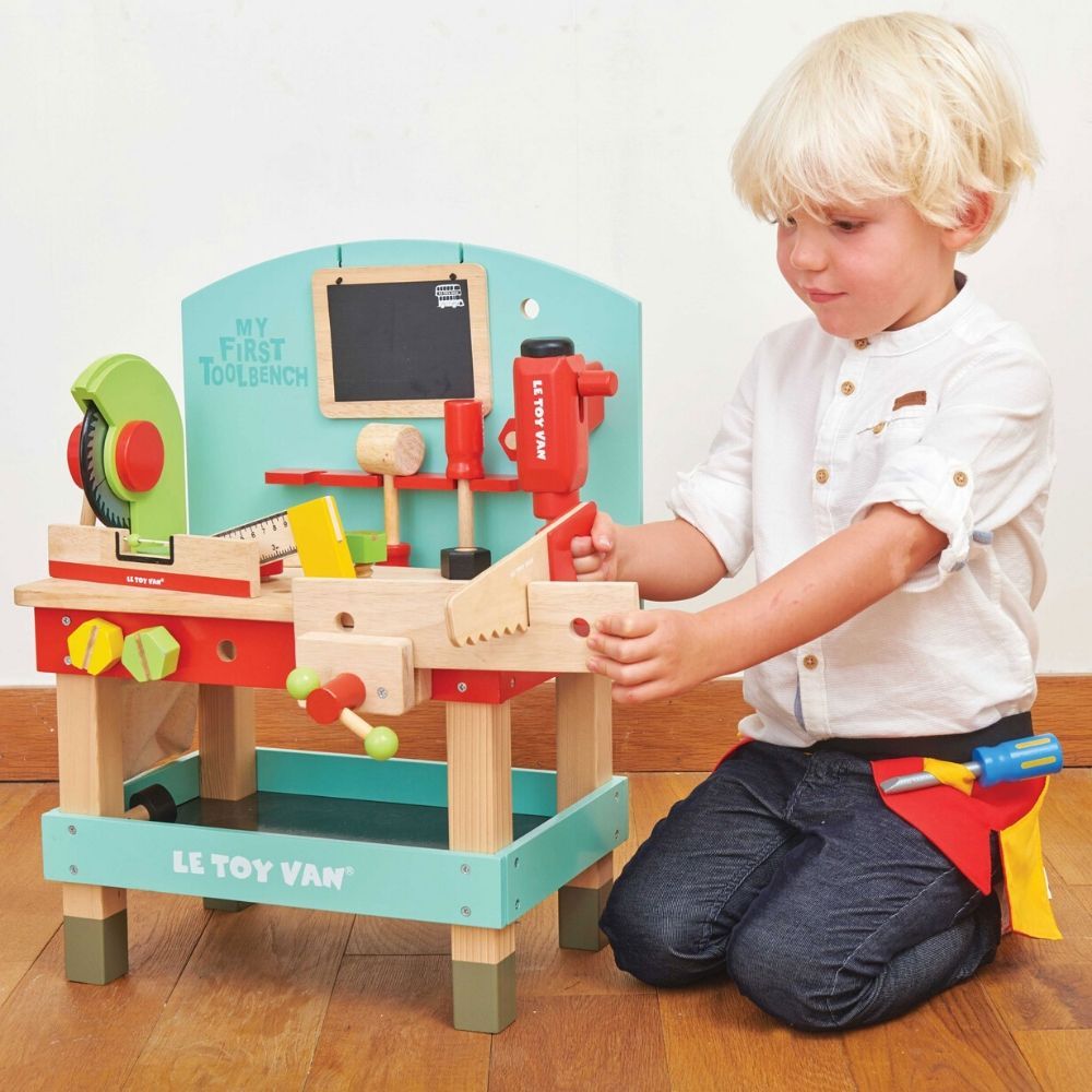 LeToy Van Wooden Tool Bench, Unleash your child's inner builder with our wooden tool bench toy and power tools. This exciting and comprehensive set is perfect for introducing little ones to the world of construction and imaginative play. Crafted from high-quality, solid wood, this eco-friendly toy is built to withstand the test of time. Not only is it safe for your child to play with, but it is also sustainable, making it a conscious choice for the planet. The set includes a drill and turning saw, giving ch