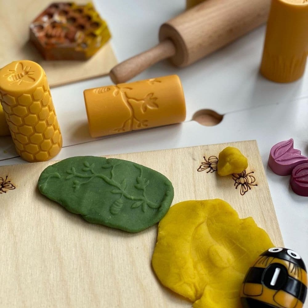 Let's Roll Garden Bugs pk 6, These Let's Roll Garden Bugs rollers offer an imaginative way for children to explore the natural world through creative play. Roll into play dough or clay and stamp with the bugs to create hands-on habitats! Count the bees on the honeycomb, match the ladybirds to flowers and tell stories of what is happening close by when you look carefully. Children can experiment using different amounts of pressure and rolling in different ways, honing their fine motor skills as they create t