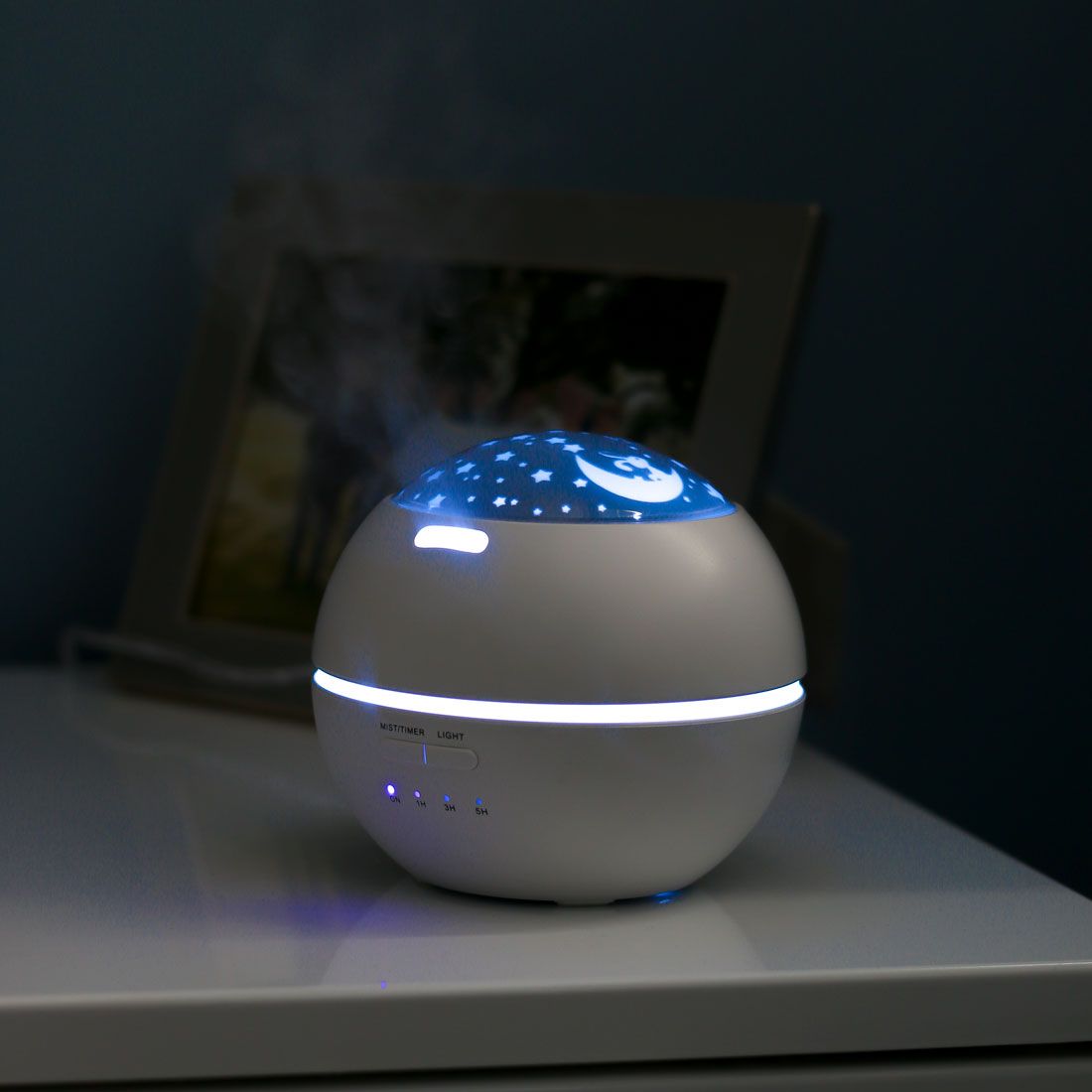 Lifemax Star Projection Humidifier, Our stylish Aromatherapy Humidifier will help you to relax and unwind with a colour changing scene projected onto your ceiling. The generous mist will bring relief from the dry air associated with colds, dry skin and Asthma and allergies, while the addition of essential oils offers a treat for your senses. Ideal for use in the bedroom, the humidifier has options of continuous operation or 1/3/5 hour timers. For those easily disturbed at night, the unit features a quiet-ru