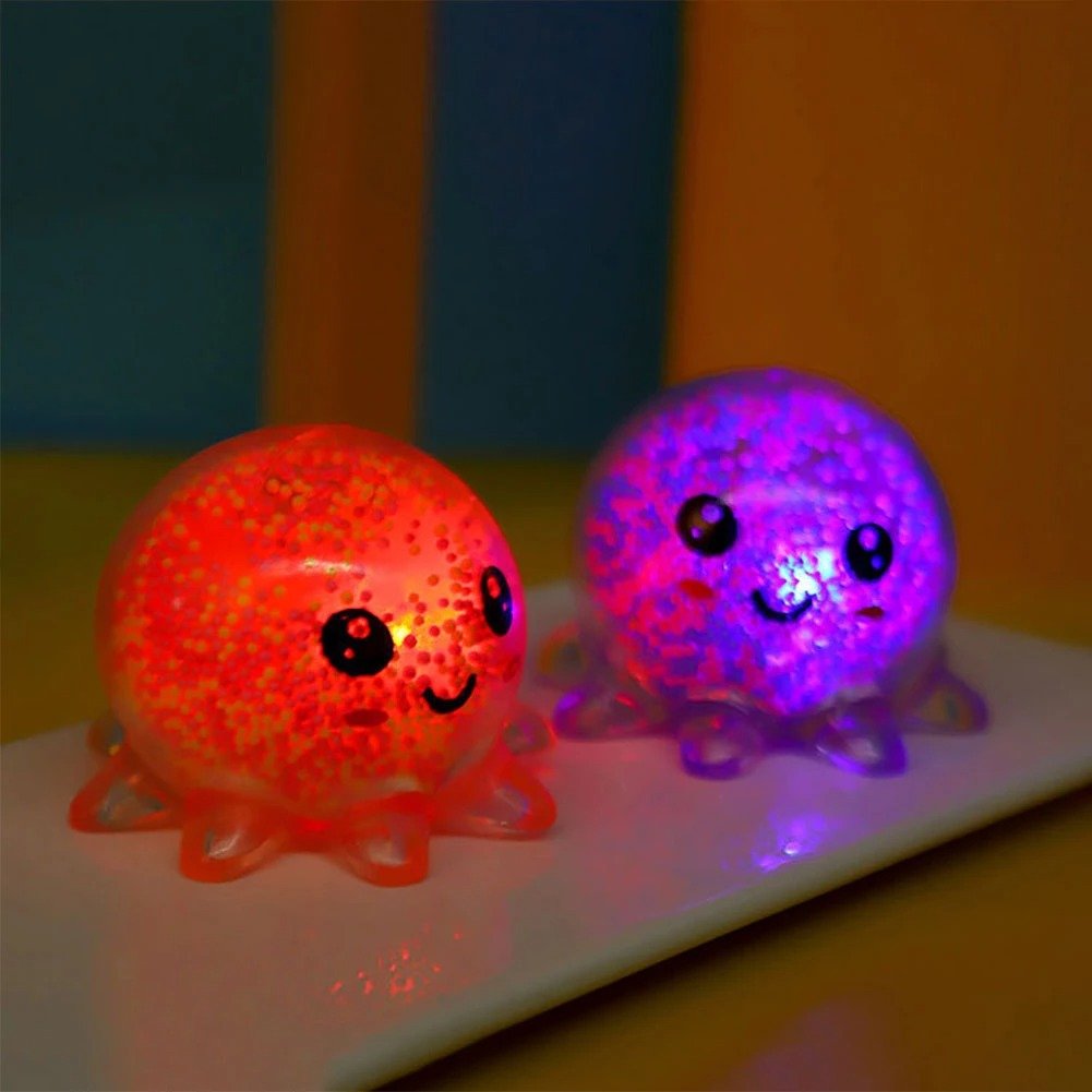 Light-Up Octopus, This Light-Up Octopus is made from soft wiggly rubber surrounded by asquishy air-filled interior. The Light-Up Octopus is made of a squishy air-filled interior. As the Light-Up Octopus is squeezed the little plastic beads inside move about and make different patternsPerfect for sensory play, stress relief or as a decorative item for your child's room, the Light-Up Octopus is an entertaining and captivating toy that will bring hours of fun for children of all ages. This Light-Up Octopus is 