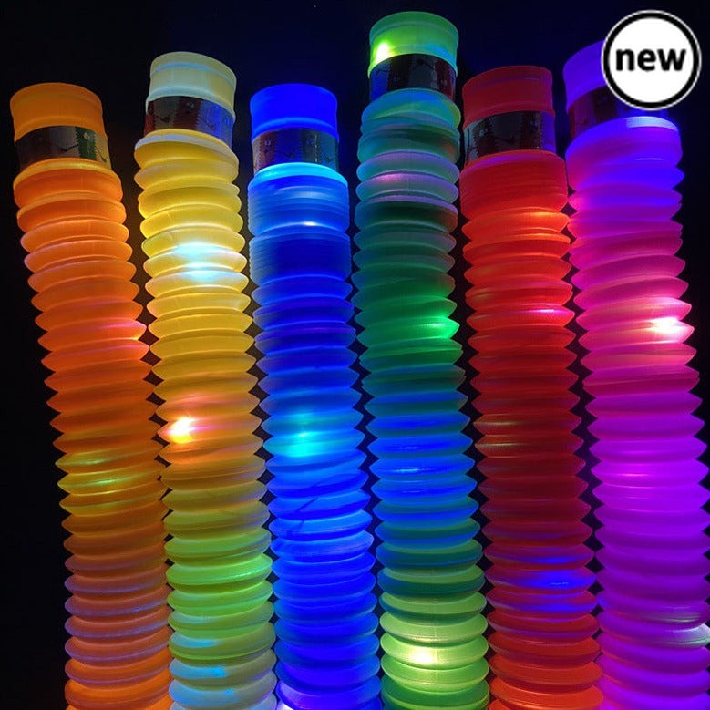 Light Up Pop Tubes 3 Pack, The Light Up Fidget Pop Tubes are brightly coloured light up bendy pop tubes that can expand and contract. This set of Light Up Fidget Pop Tubes appears compact at first, but pull on either end and they will open up into long tubesWhat's more, they can bend round and connect end-to-end, or even attach to each other to form longer tubes. Pack includes 3 tubes in a variety of different colours. Fidget Pop Tubes Set Pack of three fidget toy tubs Bendy and flexible Can expand and cont