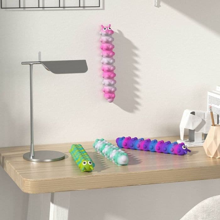 Light Up Push Popper Suction Caterpillar, Each Light Up Push Popper Suction Caterpillar is covered in small bubbles that make a gentle popping sound when pushed inwards. The bottom of the caterpillar features suction cup Feet which allows you to stick him to a smooth surface and watch him light up as you pull him away! The Light Up Push Popper Suction Caterpillar is suitable for children and adults who love to fiddle and fidget, great for relieving stress and anxiety The Light Up Push Pop Caterpillar is ide