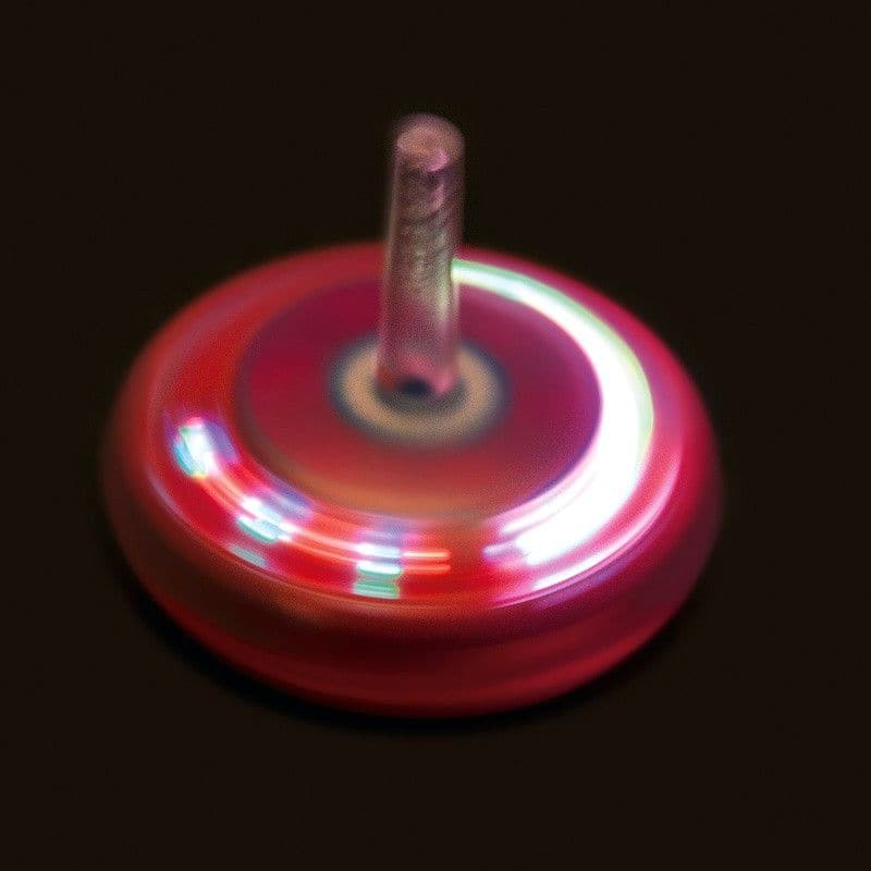 Light Up Spinning Top, Plastic spinning top that lights up as it spins. Twist the light up top and drop it on a flat surface to make it spin. As it rotates the LEDs around the edge light up and flash in a variety of patterns and colours that make quite a mesmerising effect.The Light up spinning top is a perfect toy for kids and adults alike who love to play and experiment with light. Made of durable plastic, this spinning top is designed to spin smoothly and steadily on almost any flat surface. The moment y